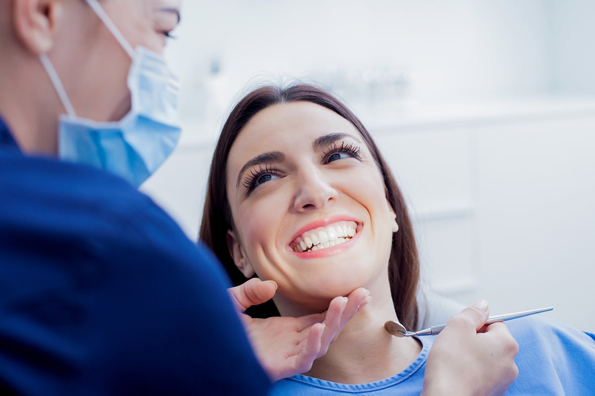 woman in dental chair smiling